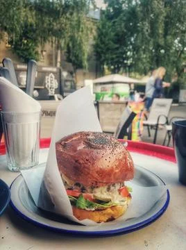 Big burger on the table Stock Photos