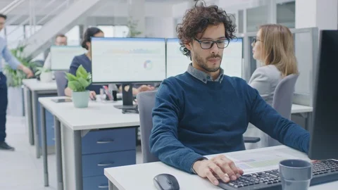 In the Big Busy Corporate Office Businessman Works on Desktop Computer Stock Footage