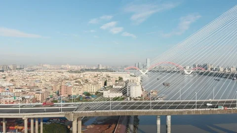 Big cable-stayed bridge across the Pearl River, ships sailing along the river Video stock 113579496