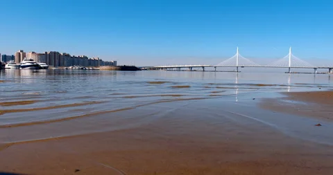 Big Cable-stayed Bridge against the blue sky in the rays of the warm morning sun Stock Footage 119613738