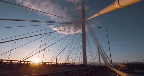 Big Cable-stayed Bridge in the rays of the warm evening setting sun  Stock Footage 119608876