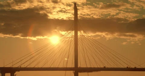 Big Cable-stayed Bridge in the rays of the warm evening setting sun Stock Footage 119608897