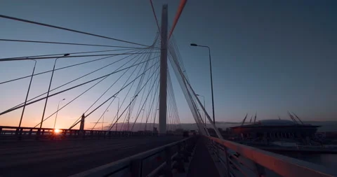 Big Cable-stayed Bridge in the rays of the warm evening sunset Stock Footage 119609356