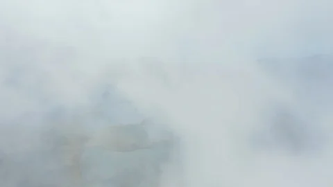 Big Caldeirao volcano through white clouds. Green fields and lakes in caldera Vidéo 118016574