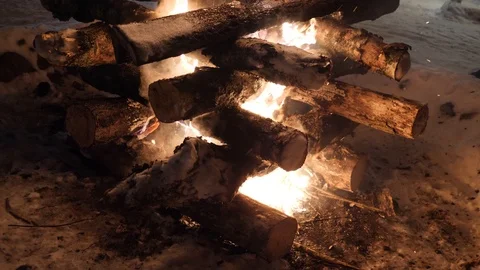 Big campfire burns in winter night. Hot and bright fire place Stock Footage 116777477