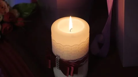 Big candle with a red ribbon Stock Footage 89671075