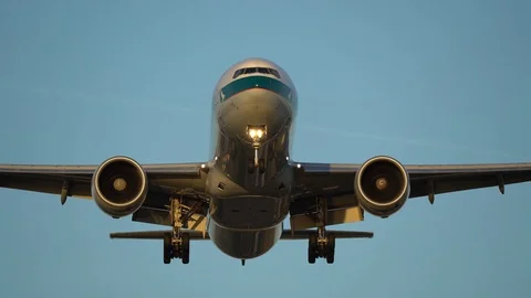 Big Cargo airplane flying overhead at dusk Stock Footage 89832066