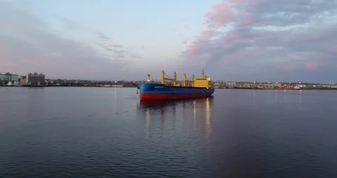 Big cargo ship prepares to enter industrial port, aerial video Stock Footage 103464151