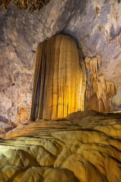Big cave and stalactite looking like a sculupture in Paradise Cave in Phong.. Stock Photos