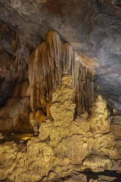 Big cave and stalactite looking like a sculupture in Paradise Cave in Phong.. Stock Photos