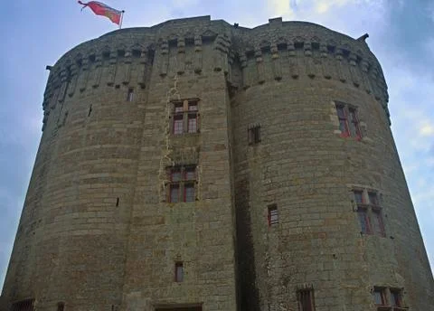 Big central stone tower with flag on top at Dinan fortress, France Stock Photos