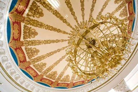 Big chandelier on the ceiling Stock Photos