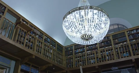 Big chandelier in the library Stock Footage 86559899