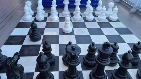 Big chess Creative chess board with big pieces on the floor of the learning Stock Footage 296219373