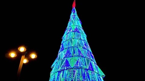 Big Christmas tree made out of green and blue triangular shape lighting. A Stock Footage 149022932