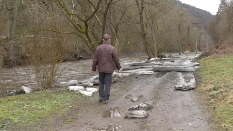 Big chunks of ice washed up on road Stock Footage 72856094