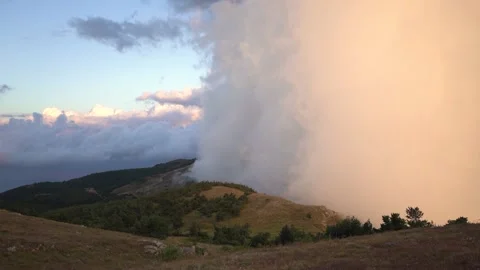 The big cloud moving  in the moutains with  soft sunset light Stock Footage 185003038