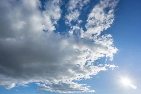 Big cloud over blue sky with sun Foto stock