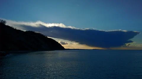 Big Cloud on the sea at sunset Stock Photos
