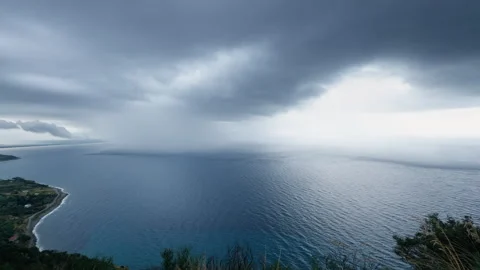 Big Cloudburst over the ocean near the coast Stock Footage 258655065