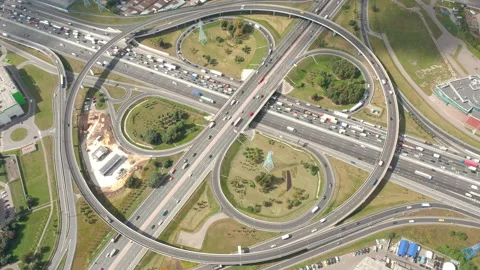 Big clover crossroads at summer in motion. Road traffic in real speed. Top view. Stock Footage 139778100
