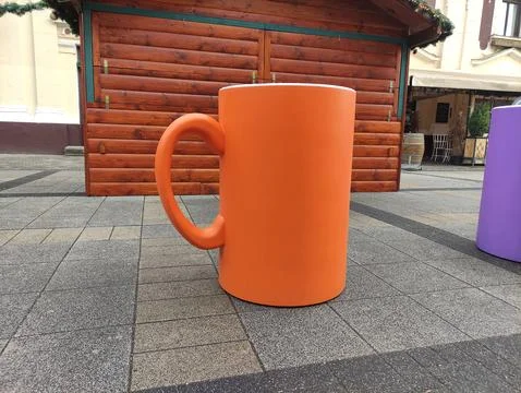 Big colorful decorative table in shape of cup in the town centrum kiosk Stock Photos