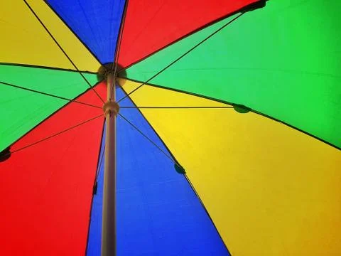 Big colourful umbrella in the summer. Stock Photos