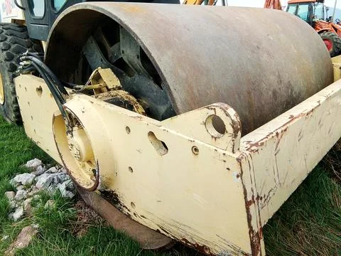 Big compactor machine at work Photos