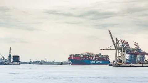 Big Container Ship leaving harbour Hamburg Stock Footage 166556891
