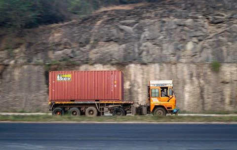 Big container on trailer , speeding towards Mumbai on highway. Stock Photos