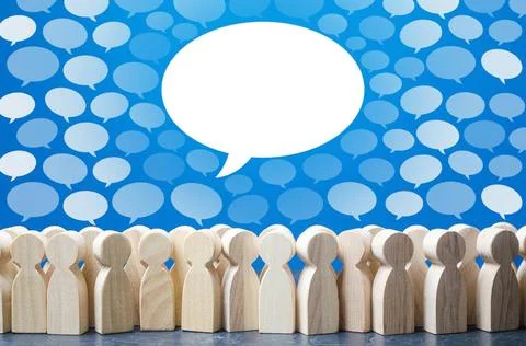 Big conversation talk cloud stands out from rest above people. Active disc... 库存照片