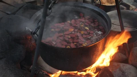 Big copper in which mulled wine at Christmas fair cooks Stock Footage 43199634