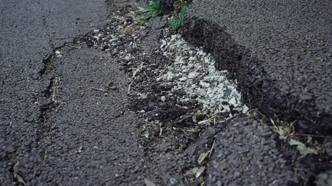 Big crack on the asphalt. 库存影片 113784838