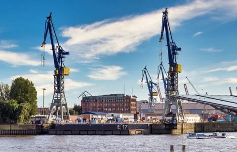 Big cranes at a dock in the port of hamburg Stock Photos