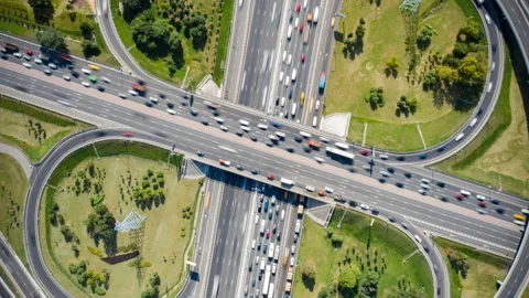 Big crossroads in fast timelapse. Top view from above. From close up to far. Stock Footage 139660079