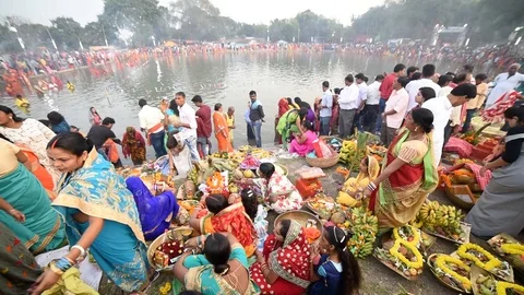 Big crowd of Hindu devotees celebrate and  worship in Chat puja festival Stock Footage 107450187