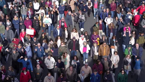 Big crowd marching together in demonstration, elevated view 4K 스톡 동영상 234397703