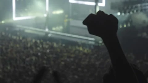 Big crowd of people clapping hands at huge arena music concert Stock Footage 145088834