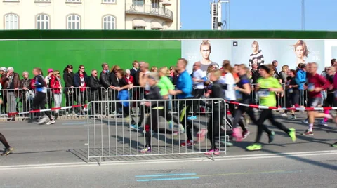 Big crowd of runners passing an audience Stock Footage 36784236