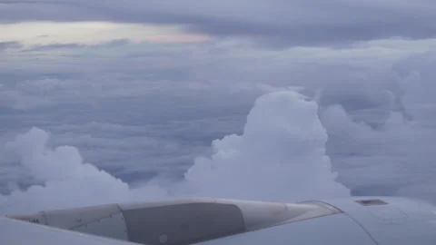 Big Cumulus Clouds from Plane Window Seat Stock Footage 291508967