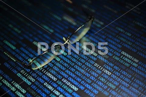 Big data analysis. blue binary code on led panel with black background and gl Stock Photos