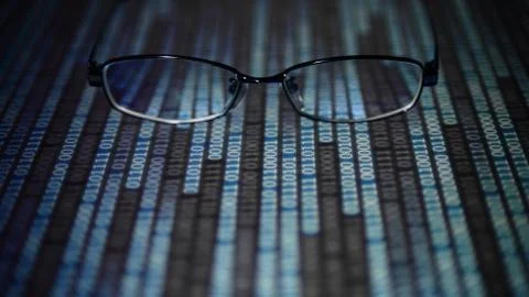 Big data analysis. glasses placed on a LED digital panel display white light Stockfoto's