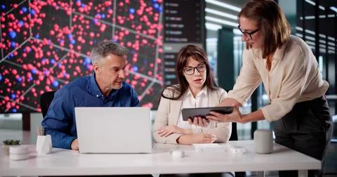 Big Data Center: AI Engineer And Technician Researching Computer System Stock Photos
