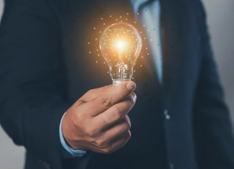 Big data concept: hand-holding light bulb (idea) and global internet connec.. Stock Photos