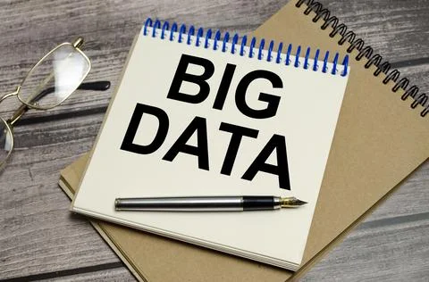 Big data on notebook and pen on wooden background Stock Photos