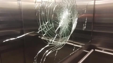 Big dent on broken mirror in elevator, mobile 库存影片 299615503