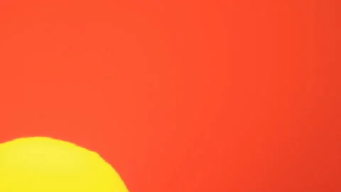 Big disk of sun rising in sky Video stock 136386669
