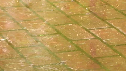 Big drops of rain on background of the road tiles. Stock Footage 107540342