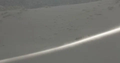 Big dune with wind blowing sand over surface at sunset, detail of dune's top 스톡 동영상 103498752