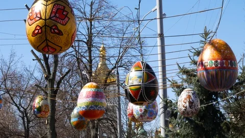 Big Easter eggs on the street with christian church background Stock Footage 88295203